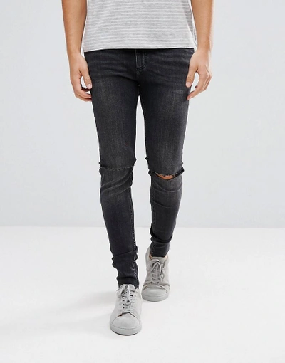 CHEAP MONDAY HIM SPRAY SUPER SKINNY JEANS USED BLACK WITH KNEE RIP - BLACK