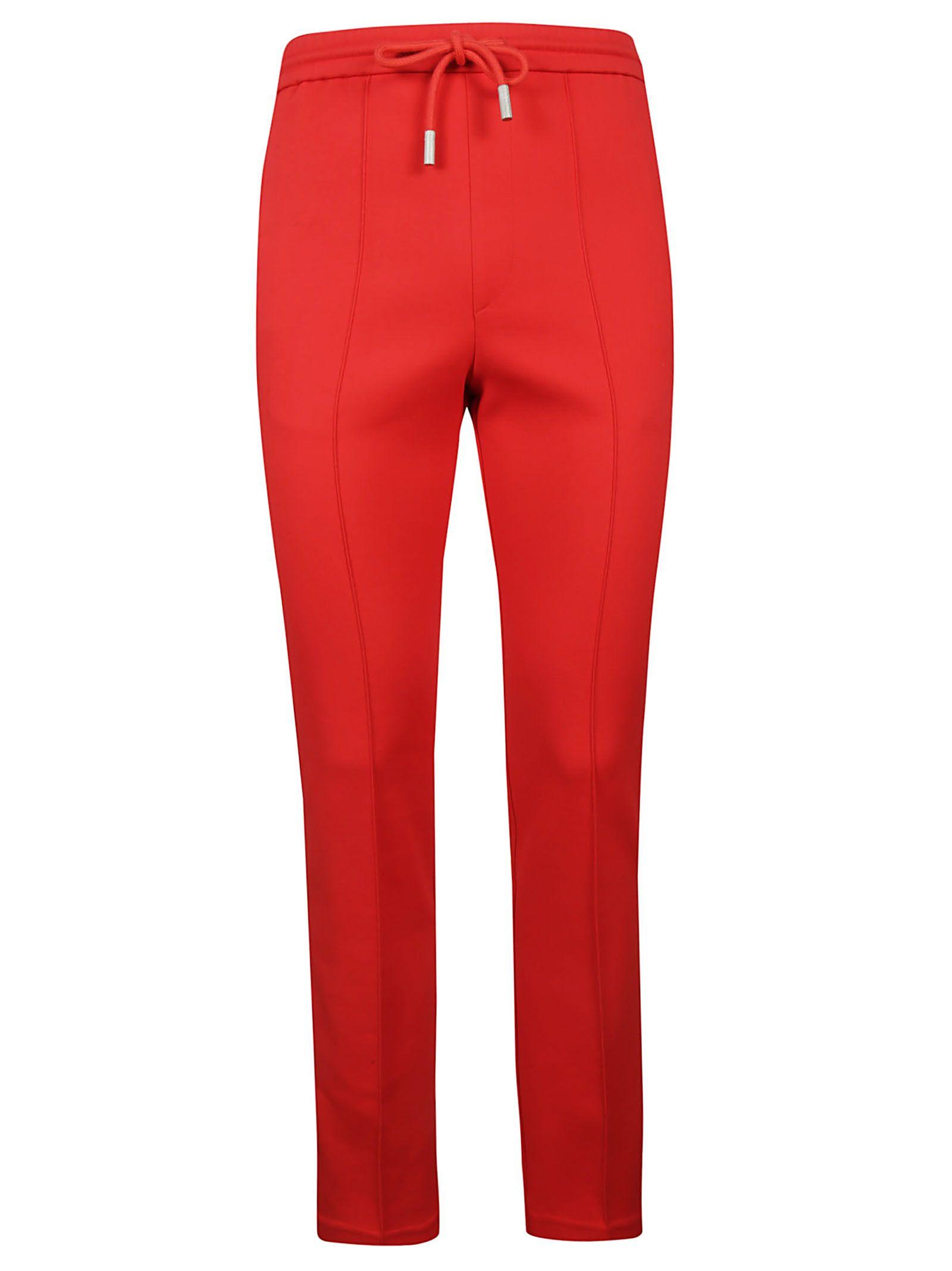 red track pants with white stripe