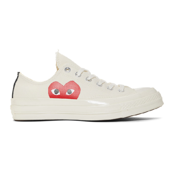 white converse with a heart