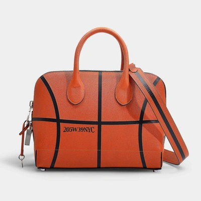 Shop Calvin Klein 205w39nyc Dalton Basketball Small Top Handle Bag In Burnt Orange Embossed Leather