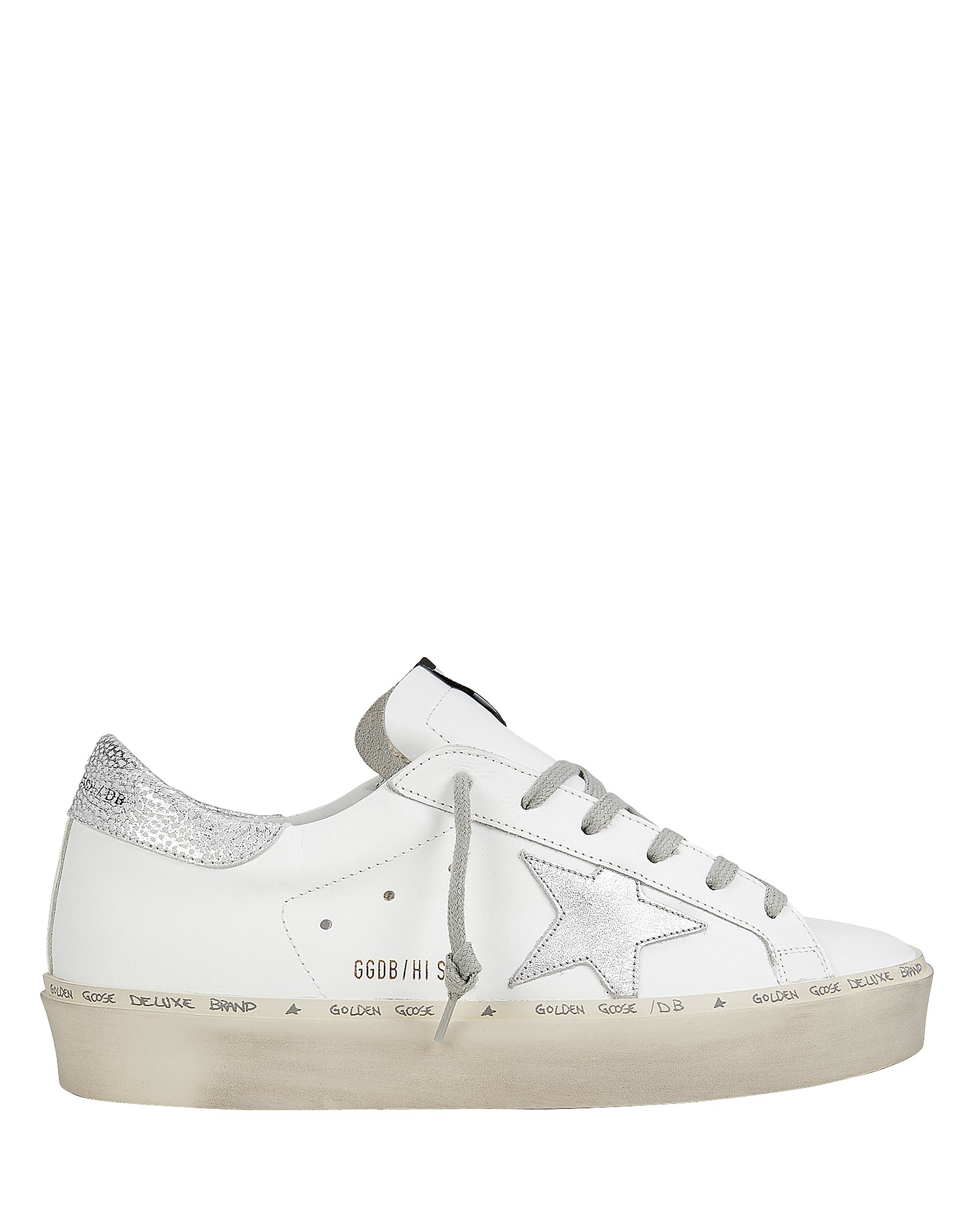 white leather sneakers with stars