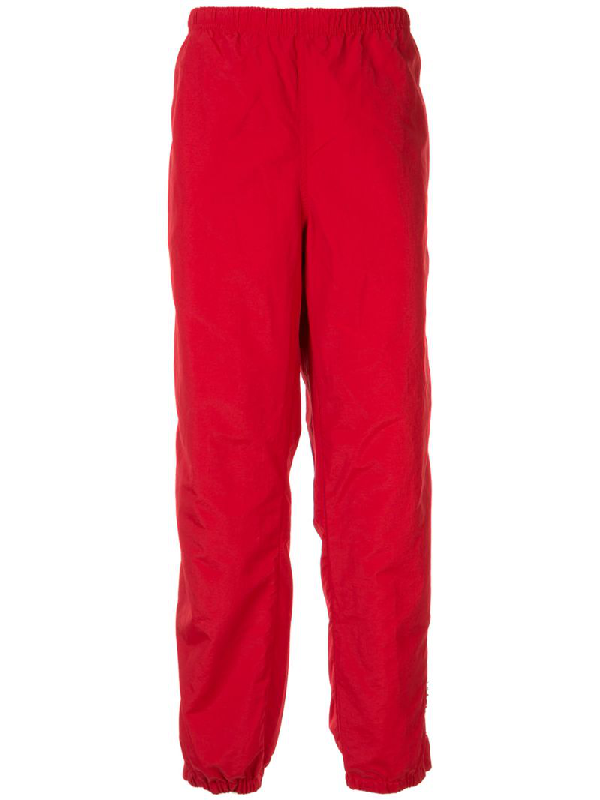 red supreme pants