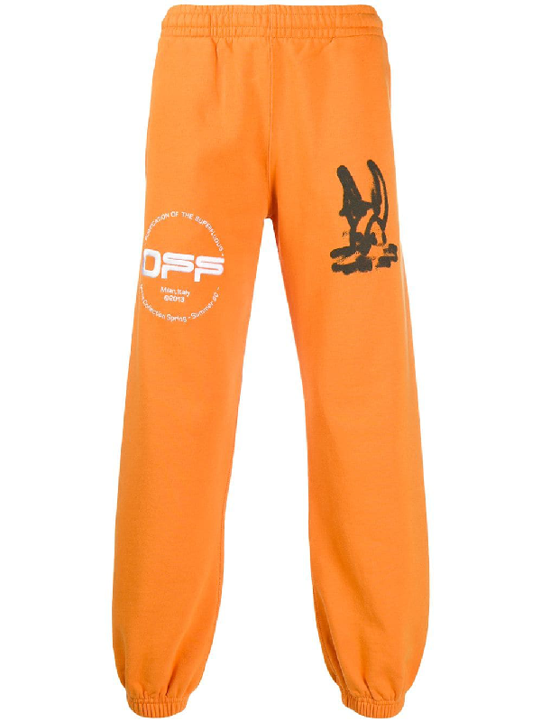 white and orange track pants