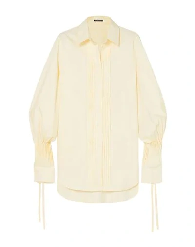 ANN DEMEULEMEESTER Solid color shirts & blouses
