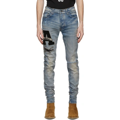 AMIRI AMIRI BLUE VARSITY PATCH JEANS