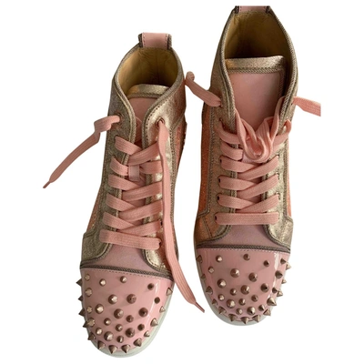 CHRISTIAN LOUBOUTIN PINK PATENT LEATHER TRAINERS