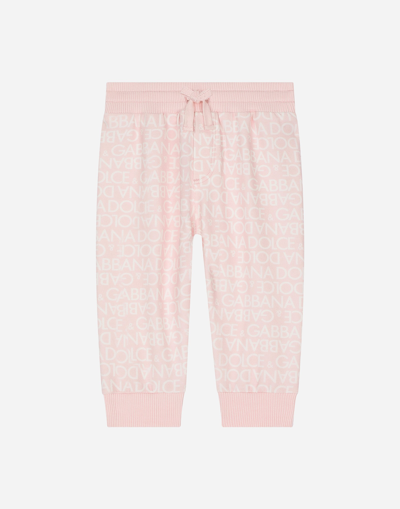 DOLCE & GABBANA JERSEY JOGGING PANTS WITH ALL-OVER LOGO PRINT