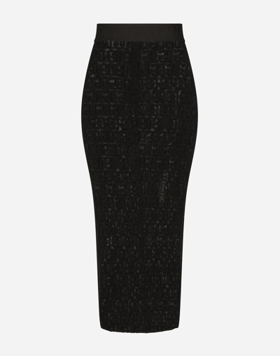 DOLCE & GABBANA TULLE CALF-LENGTH SKIRT WITH ALL-OVER DG LOGO