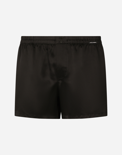 DOLCE & GABBANA SILK SHORTS WITH LOGO LABEL