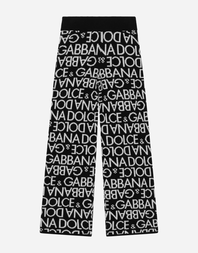 DOLCE & GABBANA KNIT PANTS WITH ALL-OVER JACQUARD LOGO