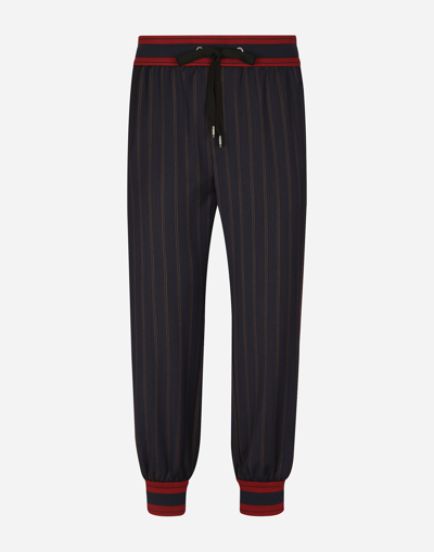 DOLCE & GABBANA PINSTRIPE JOGGING PANTS WITH BRANDED BANDS