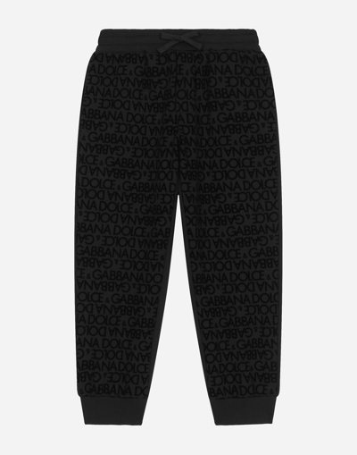 DOLCE & GABBANA JERSEY JOGGING PANTS WITH ALL-OVER FLOCKED PRINT