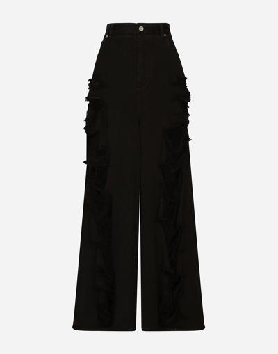 DOLCE & GABBANA FLARED JEANS WITH RIPPED DETAILS