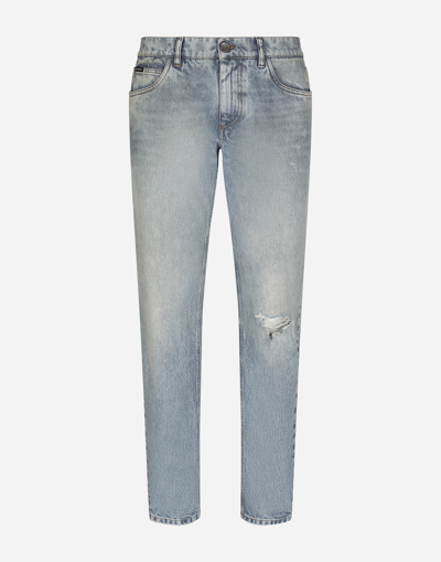 DOLCE & GABBANA LIGHT BLUE REGULAR-FIT STRETCH JEANS WITH RIPS