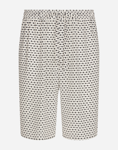DOLCE & GABBANA CREPE DE CHINE JOGGING SHORTS WITH DG LOGO PRINT