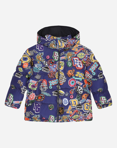 DOLCE & GABBANA NYLON DOWN JACKET WITH HOOD AND STICKERS PRINT