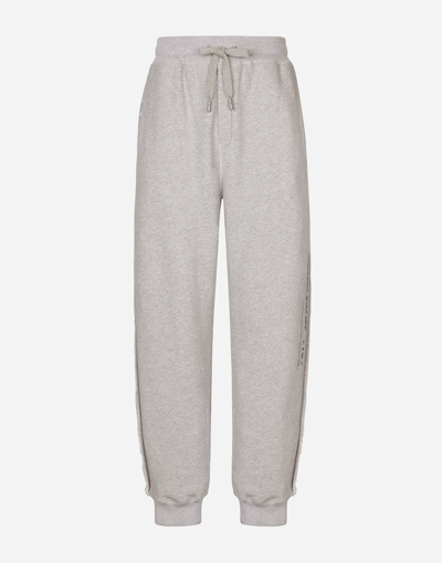 DOLCE & GABBANA PRINTED JOGGING PANTS WITH SMALL ABRASIONS