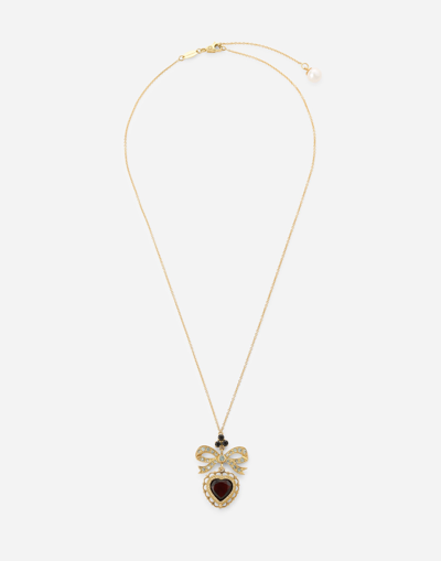 DOLCE & GABBANA HEART PENDANT IN YELLOW GOLD WITH RODOLITH GARNET AND SAPPHIRES