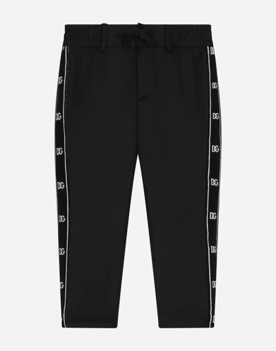 DOLCE & GABBANA STRETCH WOOLEN PANTS WITH LOGO BAND