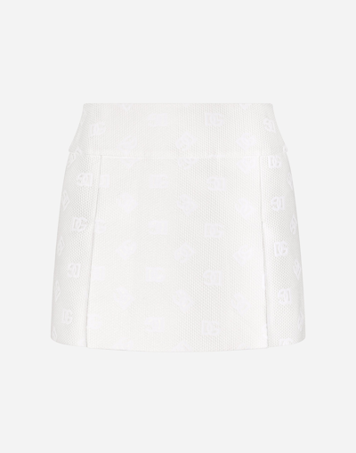 DOLCE & GABBANA JACQUARD MINISKIRT WITH ALL-OVER DG LOGO