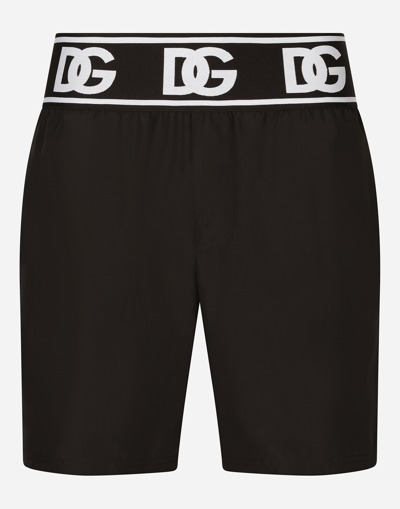 DOLCE & GABBANA MID-LENGTH SWIM TRUNKS WITH BRANDED ELASTIC