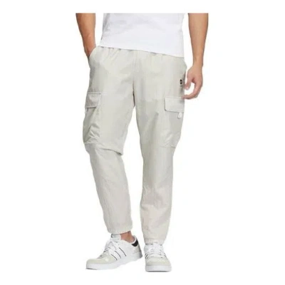 ADIDAS ORIGINALS Men's adidas neo Solid Color Multiple Pockets Woven Bundle Feet Sports Pants/Trousers/Joggers Bauxit