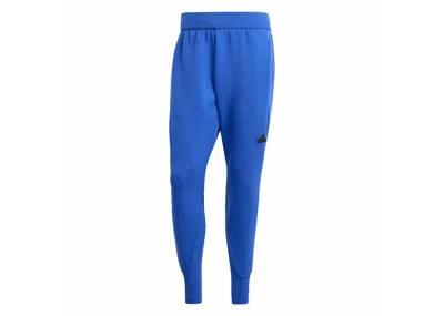 ADIDAS ORIGINALS MEN'S ADIDAS Z.N.E. PREMIUM PANTS IN SEMI LUCID BLUE