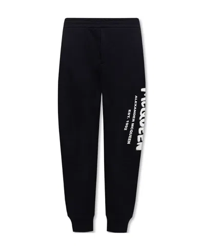 ALEXANDER MCQUEEN ALEXANDER MCQUEEN LOGO PRINTED SLIM CUT TRACK TROUSERS