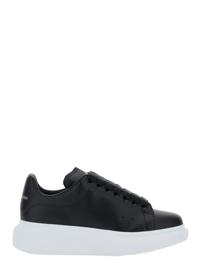 ALEXANDER MCQUEEN ALEXANDER MCQUEEN WOMEN BLACK LOW TOP SNEAKERS WITH LOGO LETTERING ON TONGUE AND HEEL IN LEATHER WOM