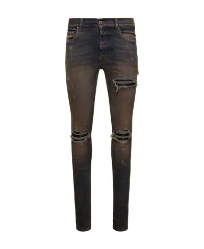 AMIRI RIPPED JEANS