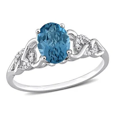 AMOUR AMOUR 1 5/8 CT TGW OVAL LONDON BLUE TOPAZ AND DIAMOND ACCENT LINK RING IN 10K