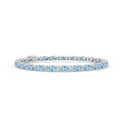 ANGARA CLASSIC OVAL AQUAMARINE AND DIAMOND TENNIS BRACELET