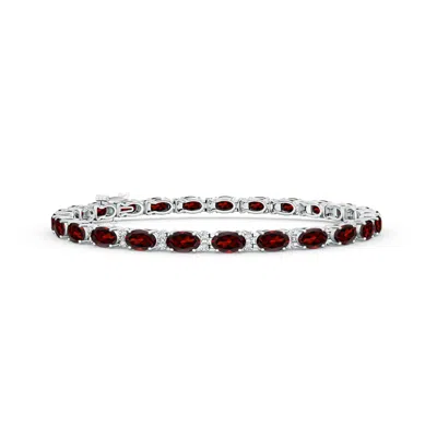 ANGARA CLASSIC OVAL GARNET AND DIAMOND TENNIS BRACELET