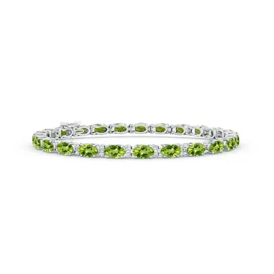 ANGARA CLASSIC OVAL PERIDOT AND DIAMOND TENNIS BRACELET