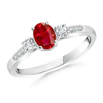 ANGARA CLASSIC OVAL RUBY AND ROUND DIAMOND THREE STONE ENGAGEMENT RING