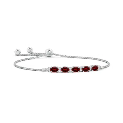 ANGARA EAST-WEST OVAL GARNET BOLO BRACELET WITH DIAMONDS