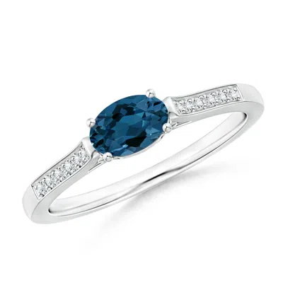 ANGARA EAST-WEST OVAL LONDON BLUE TOPAZ SOLITAIRE RING WITH DIAMONDS