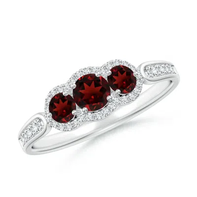 ANGARA FLOATING THREE STONE GARNET RING WITH DIAMOND HALO