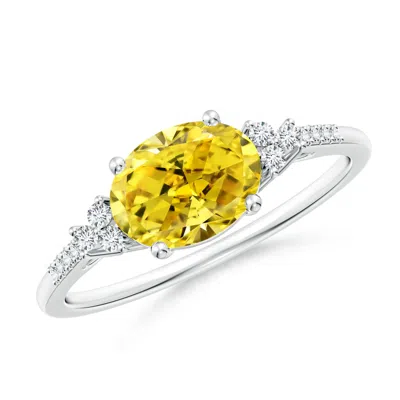 ANGARA HORIZONTALLY SET OVAL FANCY INTENSE YELLOW DIAMOND RING