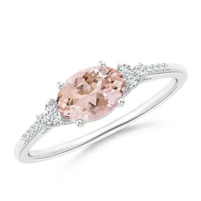 ANGARA HORIZONTALLY SET OVAL MORGANITE SOLITAIRE RING WITH TRIO DIAMOND ACCENTS