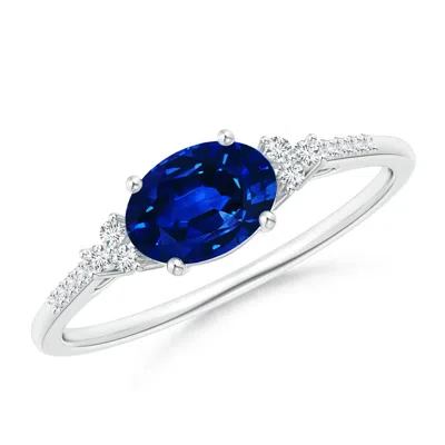 ANGARA HORIZONTALLY SET OVAL SAPPHIRE SOLITAIRE RING WITH TRIO DIAMOND ACCENTS