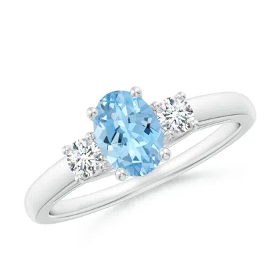 ANGARA OVAL AQUAMARINE AND ROUND DIAMOND THREE STONE RING
