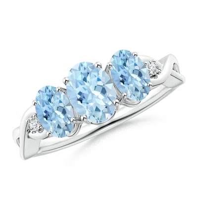 ANGARA OVAL AQUAMARINE THREE STONE CRISS-CROSS ENGAGEMENT RING