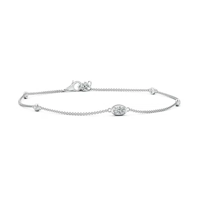 ANGARA OVAL DIAMOND STATION BRACELET WITH BEZEL-SET ACCENTS