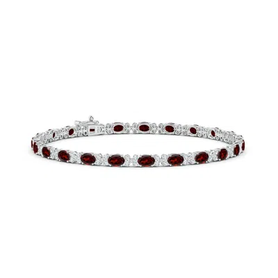 ANGARA OVAL GARNET TENNIS BRACELET WITH DIAMONDS