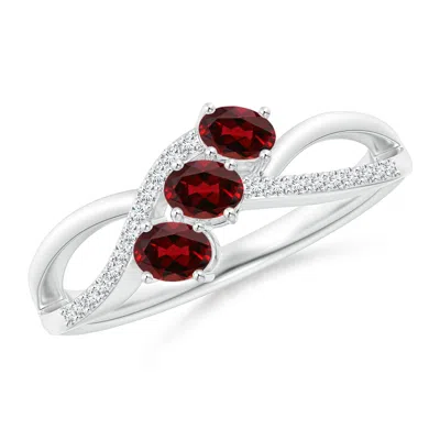 ANGARA OVAL GARNET THREE STONE BYPASS RING WITH DIAMONDS