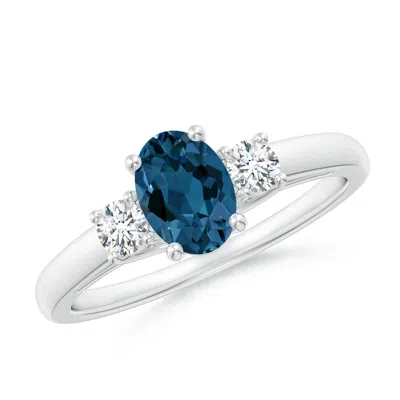 ANGARA OVAL LONDON BLUE TOPAZ AND ROUND DIAMOND THREE STONE RING