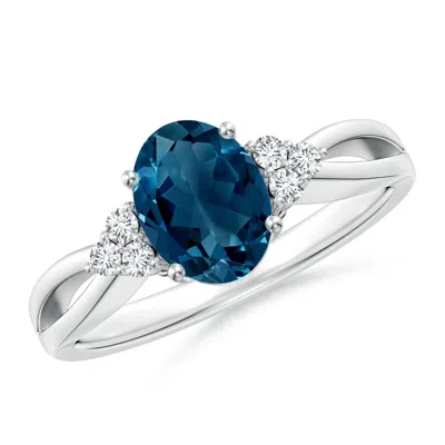 ANGARA OVAL LONDON BLUE TOPAZ SPLIT SHANK RING WITH TRIO DIAMONDS
