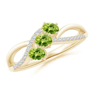 ANGARA OVAL PERIDOT THREE STONE BYPASS RING WITH DIAMONDS