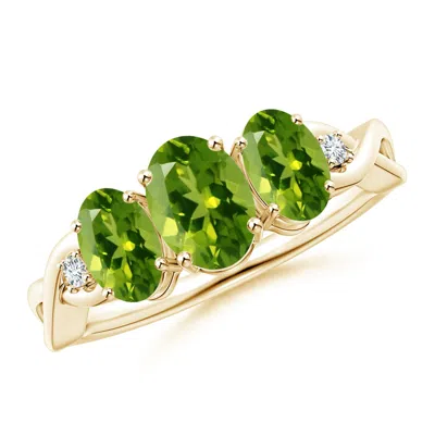 ANGARA OVAL PERIDOT THREE STONE CRISS-CROSS RING